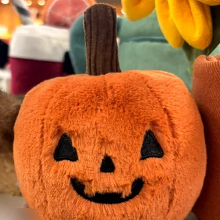 Jellycat Ooky Jack O Lantern pumpkin on a shop shelf, photographed by Plushie Finds